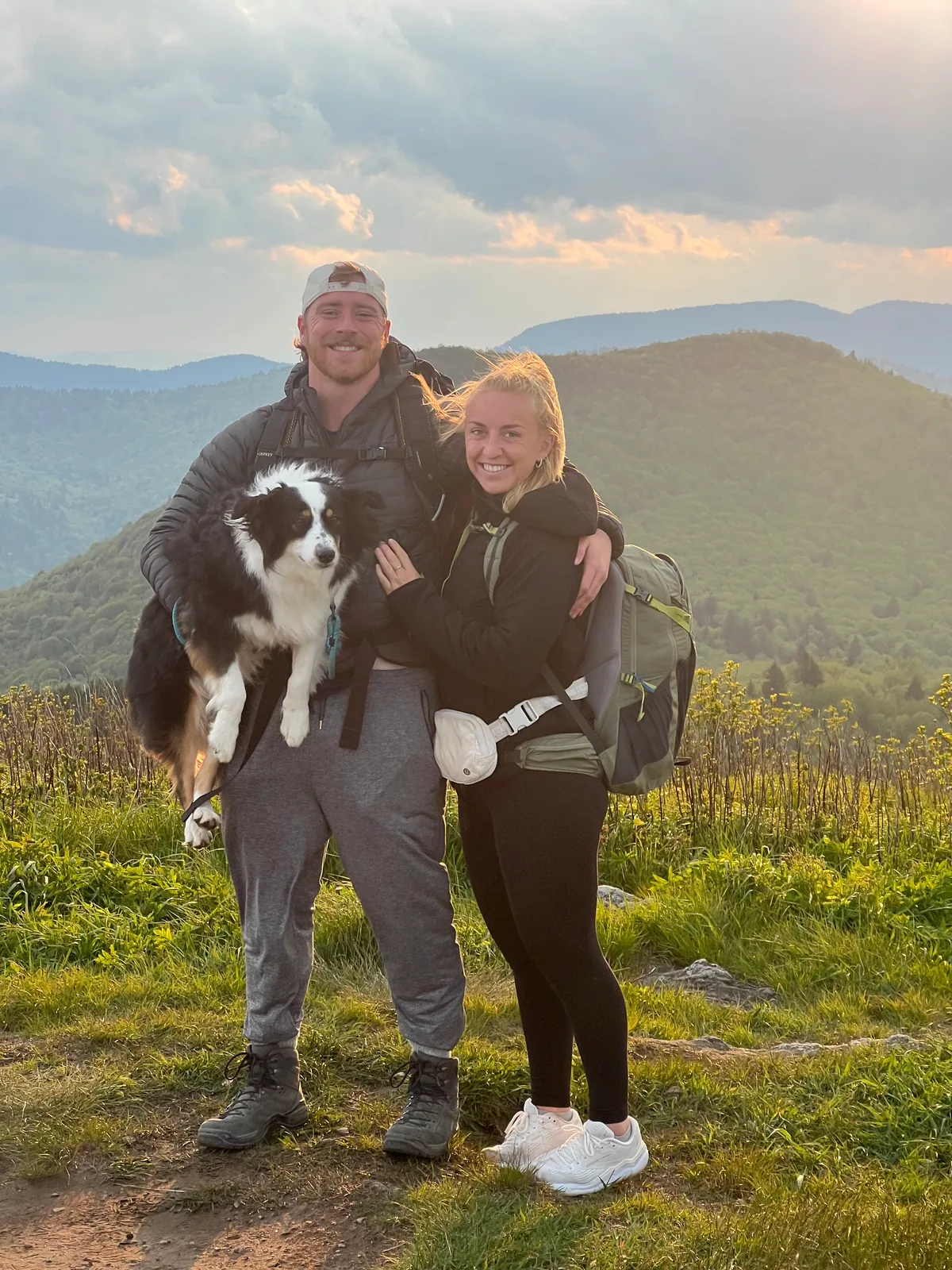 Dr. Harrison Daniels hiking with his fiancée, Rachel, and their dog, Dolly