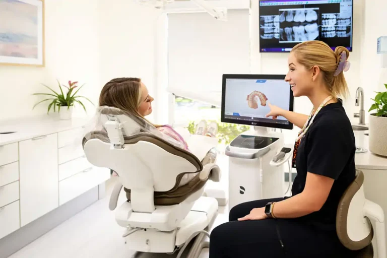 Dental hygienist showing a digital scan of inside a mouth to a dental patient at Apalachee Bay Family Dental in Tallahassee, FL.